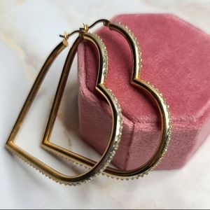 Diamond accent heart shaped hoops gold over sterling silver
